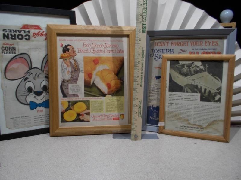 lot 61 image: The image displays a collection of framed vintage advertisements