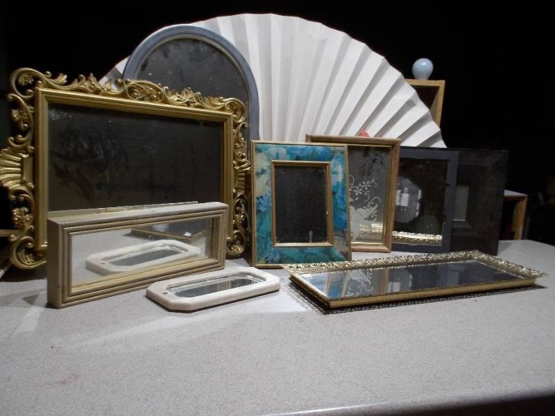 lot 69 image: The image displays a variety of vintage or antique picture frames and mirrored trays.