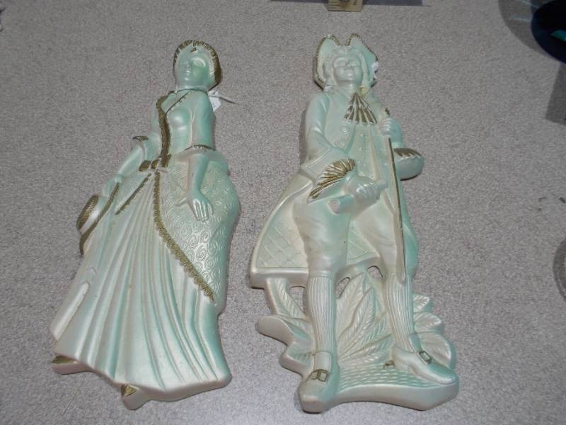 lot 115 image: These are vintage ceramic figurines, likely French Provincial or Colonial Regency style, featuring a gentleman and a lady