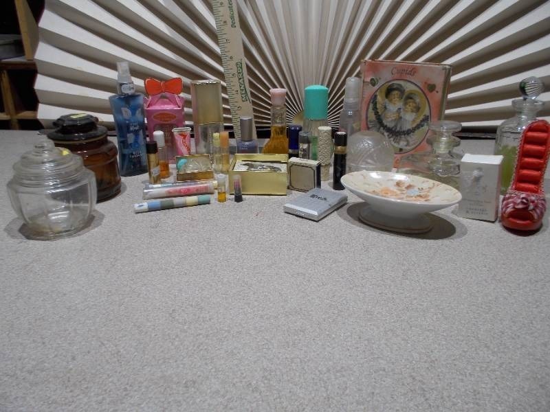 lot 139 image: The collection includes various sizes, shapes, and colors of glass bottles