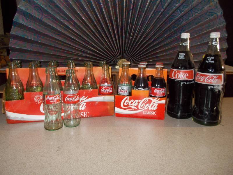 lot 236 image: Vintage Coke Bottles-Some Still Full
