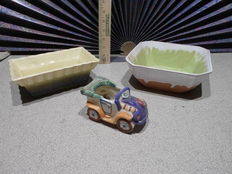 lot 153 image: The image features several ceramic planters,