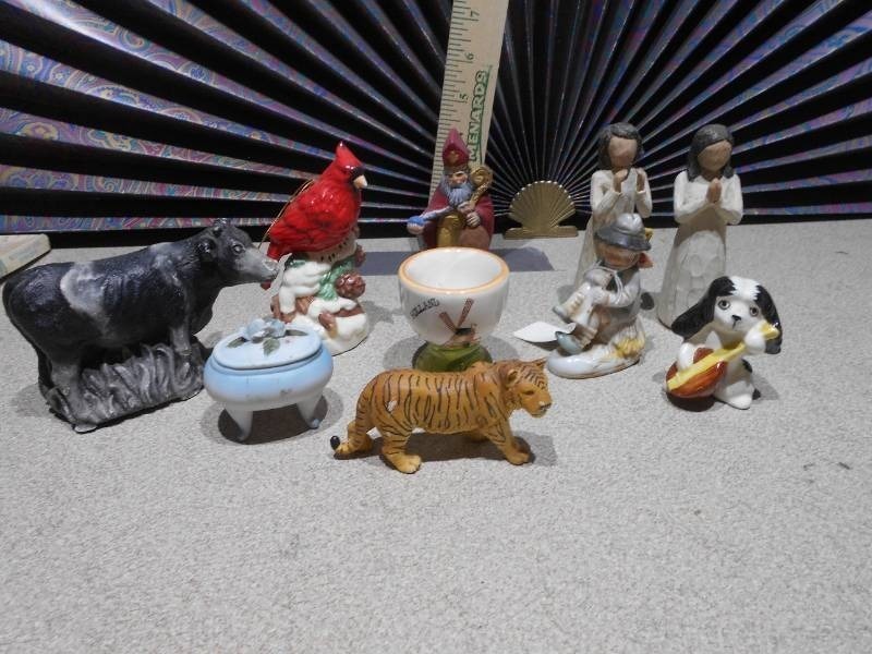 lot 165 image: The image displays a collection of various ceramic figurines