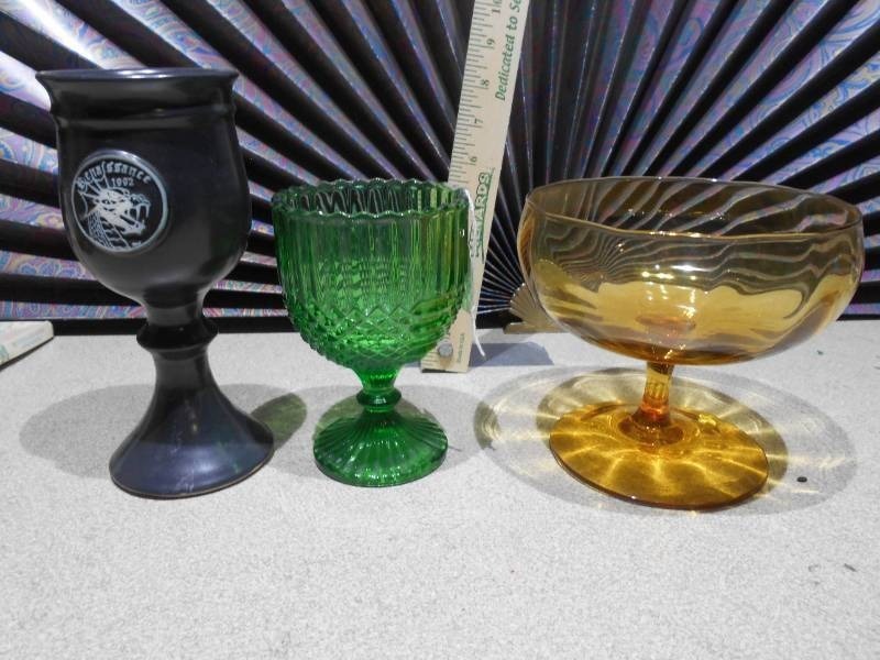 lot 174 image: The image displays a collection of vintage pressed glass goblets and a compote dish.