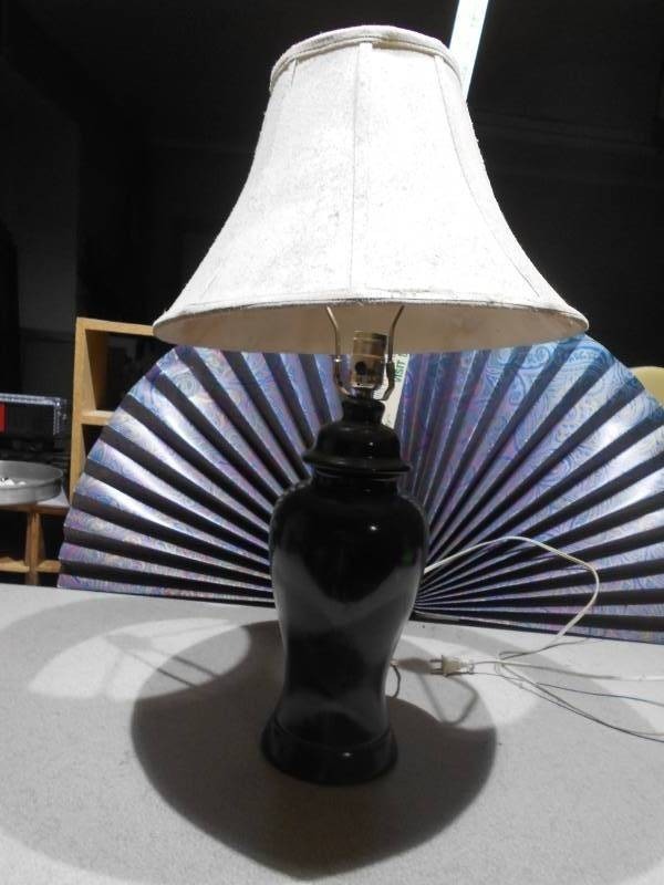 lot 182 image: This is a black ceramic ginger jar table lamp