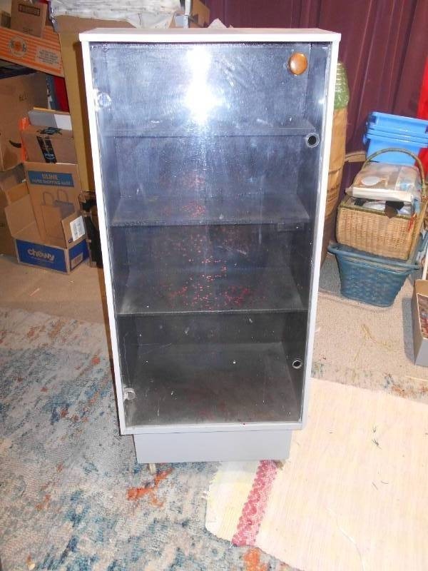 lot 189 image: This is a vintage industrial steel mobile display cabinet