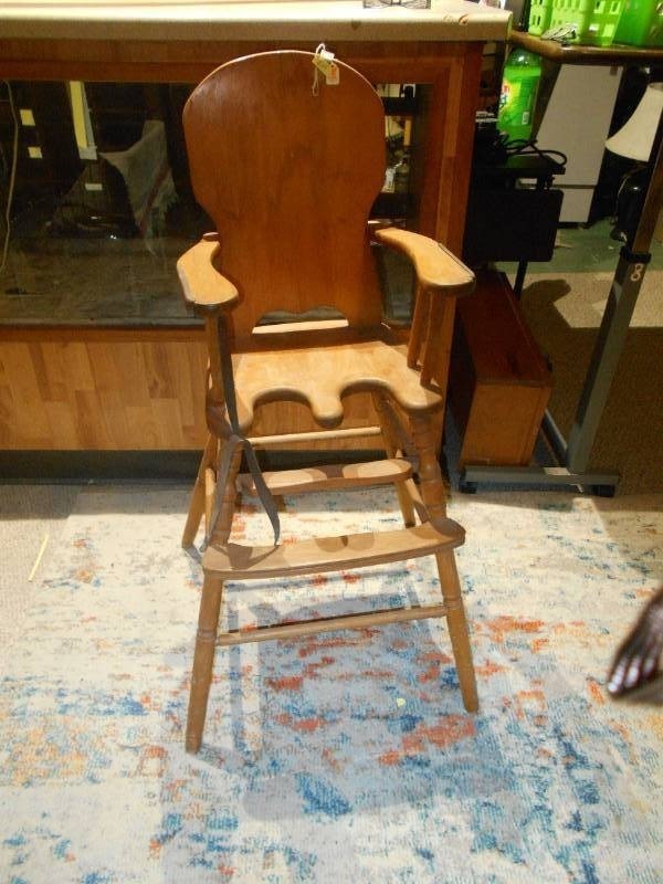 lot 193 image: This is a vintage or antique wooden high chair,