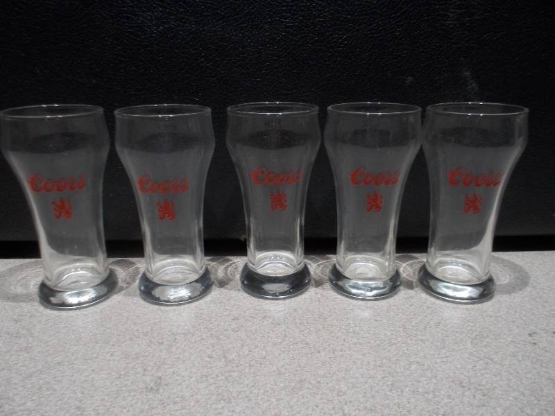 lot 269 image: This image features a set of vintage Coors beer glasses from the 1970s