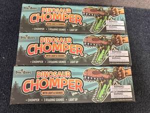 lot 29 image: 3 Dinobros Dinosaur Chompers With Sound