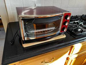 lot 38 image: Oster Countertop Toaster Oven - Red Front Panel, 3 Dial Controls