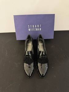 lot 70 image: Stuart Weitzman Crocodile-Embossed Patent Leather Tassel Loafers - Black