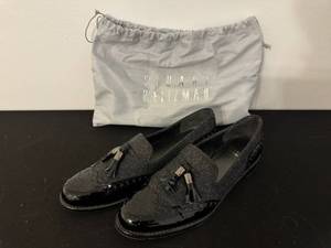 lot 73 image: Stuart Weitzman Black Patent Leather Tassel Loafers