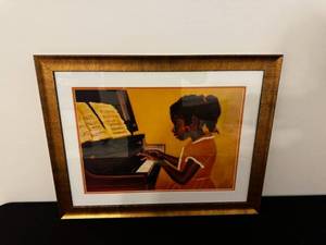 lot 80 image: Framed Wall Art - Girl Playing Piano in Orange Dress, Gold Frame