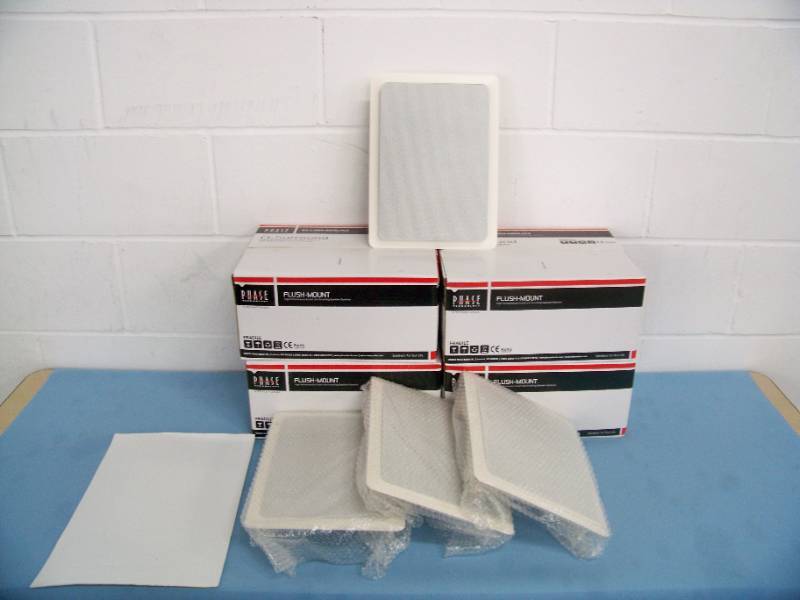 lot 26 image: (4) Phase Technologies CI-Surround (CI_SURR) Flush-Mount In-Wall Home Theater Speakers with Grilles and Mounting Brackets - NEW IN BOX