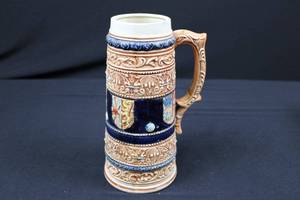 lot 8 image: Beer Stein - Japanese Ceramic with Ornate Relief Pattern and Navy Blue Bands