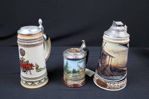 lot 9 image: Collectible Tankards with Pewter Lids - Morning Retreat, 10-Point Buck Collector Tankard & 2 German Handcrafted Steins (Lot of 4)