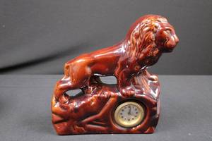 lot 13 image: Ceramic Lion Clock Figurine on Rock Base - Glossy Red-Brown Glaze