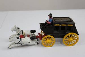 lot 22 image: Cast Iron Horse-Drawn Carriage Toy with Driver and Two White Horses