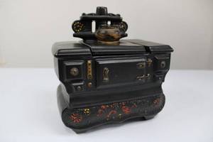 lot 58 image: Ceramic Black Decorative Stove with Floral Base and Lid