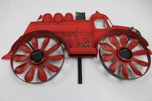 lot 62 image: Fire Engine Wall Sculpture - Vintage Red Metal Decor with Twin Solar-Cell Hubs