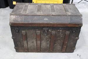 lot 150 image: Antique Iron-Banded Steamer Trunk - Ornate Hardware, Dark Patina, Vintage Metal Chest