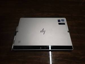 lot 25 image: HP Elite x2 1012 G2 &nbspINTEL(R) CORE(TM) I5-7200U CPU  2.50GHZ  8GB RAM  256GB SSD  No power adapter  Minor keymarks are visible on screen