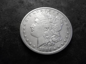 lot 16 image: 1886 S Morgan Silver Dollar