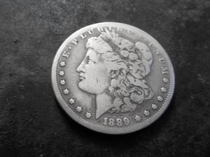 lot 21 image: 1889 CC Morgan Silver Dollar