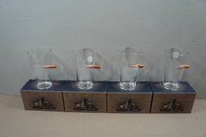 lot 174 image: Set of Four Lucky Shot Pint Glasses with Embedded Bullets