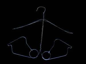 lot 43 image: Pair of Metal Wire Hangers with Hook Ends