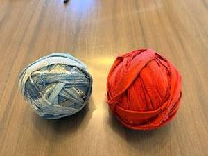lot 62 image: Denim Rag Yarn Balls - Blue Denim & Red Fabric (Lot of 2)