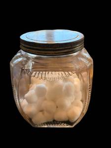 lot 84 image: Cotton Balls in Clear Glass Jar with Metal Lid - Decorative CraftStorage