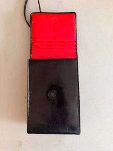 lot 297 image: HOBO Black Leather Box-Frame Clutch with Red Interior - Vintage Evening Bag