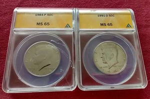 lot 7 image: (2) MS65 Kennedy Half Dollars