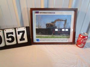 lot 57 image: Caterpillar Framed Photo - Excavator on Train Car