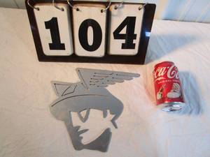 lot 104 image: Laser Cutting Reversed Mercury Head Logo