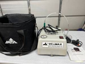 lot 44 image: Medical Industries America Model 605 Vacumax Portable Aspirator Compact 7 lb Suction Device For Medical Aspiration Of Liquids, Solids & Gases. Battery Operated & Comes With Carry Bag For Easy Transport.