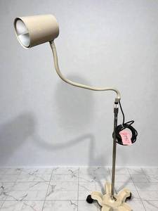 lot 14 image: Mobile Medical Exam Light   Flexible Gooseneck. Bright, shadow-free LED illumination for clinical, dental, or procedural use. Features a 5-wheel base for easy mobility, chrome pole, and adjustable gooseneck arm for precise positioning.