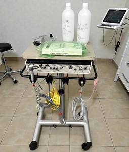 lot 11 image: MSRP $8000 A-dec Mobile Dental Delivery Cart Equipped with automatic handpiece controls, airwater coolant, 2L water bottle &amp air vacuum with saliva ejector. Compact, mobile design easy to move &amp keeps dental procedures smooth &amp efficient.