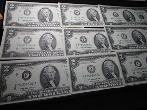 lot 113 image: Nine Two Dollar Bills