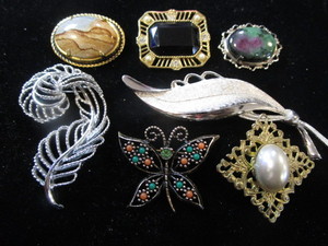 lot 308 image: Seven Brooches  Pins