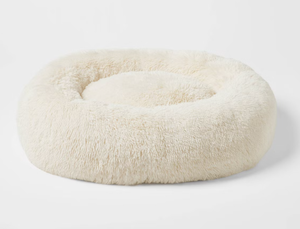 lot 168 image: Boots & Barkley Donut Bolster Dog Bed - Cream - L 36 Inches (L), 8 Inches (H) x 29 Inches (W)
