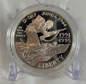 lot 38 image: 1995 1991-1995-P World War II 50th Anniversary Proof Silver Dollar  - just the coin in a protective plastic case