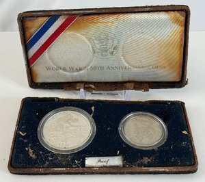 lot 42 image: 1995 1991-1995 World War II 50th Anniversary Commemorative 2-Coin Proof Set - case is extremely fire damages, no COA, but coins appear to be in good condition