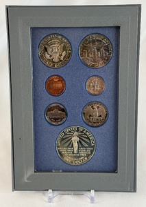 lot 43 image: 1986 Prestige Ellis Island Silver Proof set 7 coins - plastic case only, no COA, smoke damage on nearly all coins except silver dollar