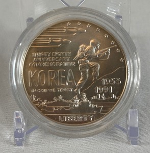 lot 52 image: 1991 D-Korean War Memorial Silver Dollar - just the coin in a protective plastic case