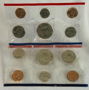 lot 129 image: 1990 uncirculated P & D us mint coin set OGP - cello wrap only, with fire damage