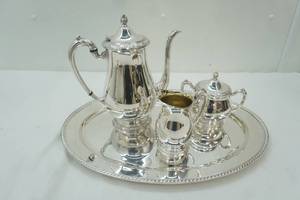 lot 1 image: Vintage Silver-Plated Tea Set. Oval Serving Tray, Tea Pot, Creamer, Covered Sugar