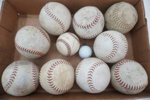lot 110 image: Softballs, 1 baseball, 1 golf ball
