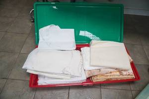 lot 215 image: Table Linens & Storage Container